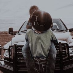 a man sitting on the back of a truck