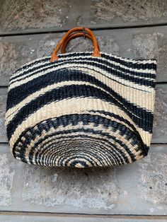 "Etra Large Kiondo shopping bag,sisal bag, storage bag, Home organizing bag,Sisal kiondo basket, Black and white kiondo bag. The bag is great for your day out shopping or at the beach. Can also be used for your home organization and storage. Dimensions Top 30\" Height 15\" Base lenght 12\" wide Ready to ship Thank you so much for shopping with us!" Large Capacity Black Bag For Market, Black Bags For Market, Artisan Black Tote Bag, Black Bucket Bag With Leather Handles For Market, Natural Top Handle Beach Bag For Market, Black Large Capacity Basket Bag, Black Large Capacity Basket Shoulder Bag, Large Capacity Black Basket Shoulder Bag, Black Basket Bag With Large Capacity