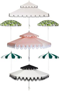 four umbrellas with different colors and designs hanging from the same pole, all in various shapes and sizes