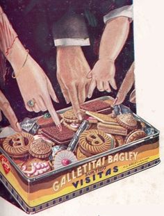 two people reaching for pastries in a box