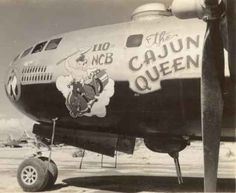 an old black and white photo shows the nose of a plane with cartoon characters painted on it