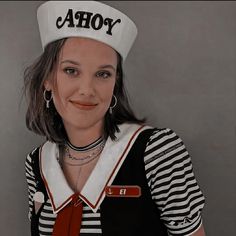 a woman wearing a sailor's hat with the word ahoy on it