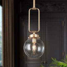 a light fixture hanging from a ceiling in a living room