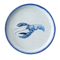 a blue and white plate with a drawing of a lobster on it's side