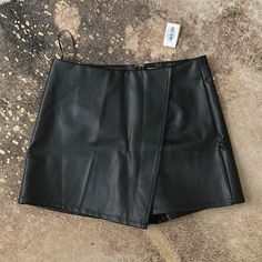 Faux Leather Black Skort Never Worn Size Large But Fits Like Medium Mini Black Leather Skirt, Chic Mini Length Faux Leather Skort, Trendy Faux Leather Mini Skort, Black Short-inseam Skort With Lined Skirt, Faix Leather Skirt, Black Faux Leather Mini Skort, Leather Skort, Asymmetrical Skort, Black Leather Skirt