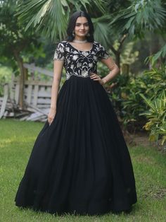 Introducing our stunning "black embroidered georgette reception wear gown" that is sure to make you stand out at any event or function. This black gown features exquisite sequin and embroidered work, adding a touch of elegance and glamour to your look. Crafted from high-quality georgette fabric, this gown is the perfect choice for those special occasions when you want to look and feel your best.
This black reception wear gown is that it comes fully stitched, saving you the hassle of alterations Floor-length Georgette Gown For Gala, Festive Georgette Gown For Gala, Embellished Embroidered Maxi Dress For Reception, Black Floor-length Dress With Sequins, Embellished Floor-length Embroidered Dress For Reception, Embellished Floor-length Dress For Reception, Embellished Embroidered Floor-length Dress For Reception, Embroidered Embellished Floor-length Dress For Reception, Floor-length Sequined Lehenga For Gala