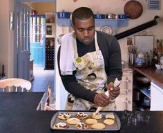 a man in an apron preparing food on top of a pan with the words rappers don't smile, but they say do not to act he hell out of some pastries