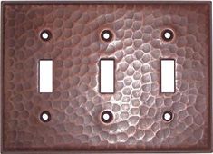 two toggles are shown with holes in the metal plate, and one is brown