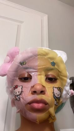 a woman with hello kitty on her face