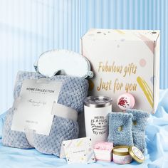 a blue gift box filled with personal care items