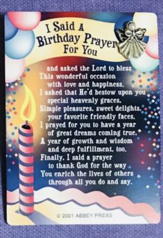 a birthday card with a lit candle and poem on the front saying, i said a birthday prayer for you