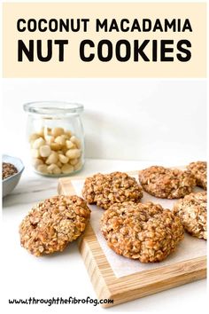 coconut macadamia nut cookies are on a cutting board with nuts in the background