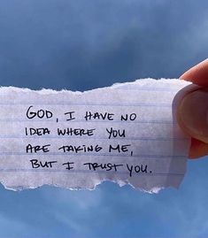 someone holding up a piece of paper that says god, i have no idea where you are trying me but if trust you