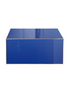 a blue table with gold trim on the top and bottom, against a white background