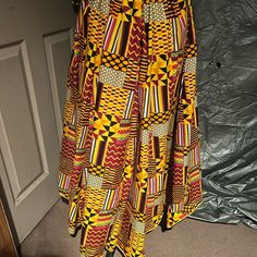 Beautiful Maxi Skirt, African Print, Yellow, Red, Orange Multi Colored Yellow Knee-length Pleated Skirt, Yellow Pleated Flared Skirt, Yellow Knee-length Flowy Skirt, Yellow Relaxed Midi Skirt, Yellow Relaxed Knee-length Skirt, Yellow Knee-length Relaxed Fit Skirt, Relaxed Yellow Knee-length Skirt, Yellow Lined Mini Skirt, Yellow Mini Skirt With Lining