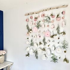 there is a wall decoration with flowers on it