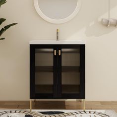 a bathroom vanity with a mirror above it and a potted plant in the corner