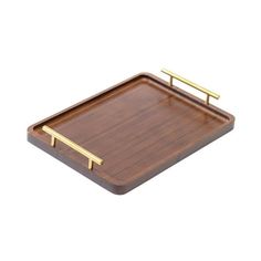 a wooden tray with gold handles