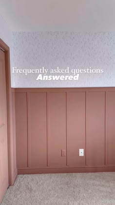 an empty room with wooden paneling and a sign that says frequently asked questions answered