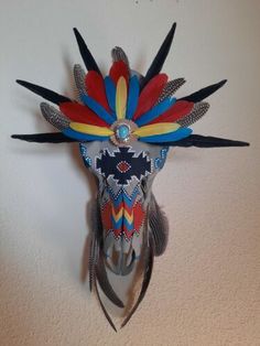 a colorful mask hanging on the wall