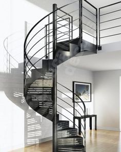 a spiral staircase in an empty room