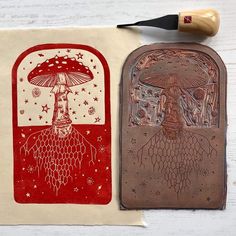 two rubber stamps with designs on them sitting next to each other, one in red and the other in white