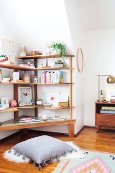 a living room filled with furniture and bookshelves