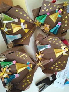 several pieces of brown paper with yellow stars on them