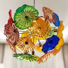 a multicolored glass chandelier hanging from a ceiling