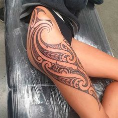 a woman's leg with a tattoo on it