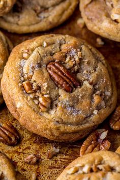 several pecan cookies with nuts on top