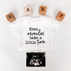 a baby t - shirt with the words even minutes take a little time on it