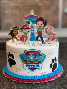 a cake with paw patrol characters on it