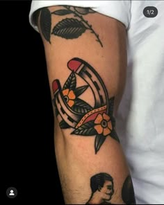 a man's arm with tattoos on it, and an image of a bird