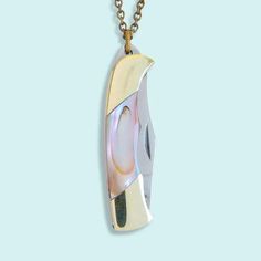 a necklace with an image of a banana hanging from it's side on a chain