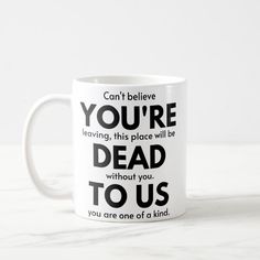 a coffee mug with the words you're dead to us on it