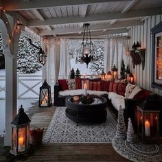 a covered porch with lots of lights and decorations