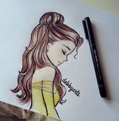 a drawing of a girl with her eyes closed next to a black marker and paper