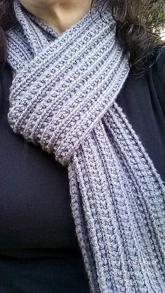 a close up of a person wearing a scarf