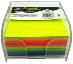 a stack of colored sticky notes on top of a clear plastic holder with two dividers