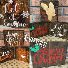 wooden christmas signs on display in front of a brick wall