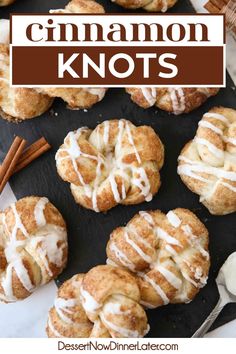 cinnamon knots with icing on top and cinnamon sticks next to it, in front of the