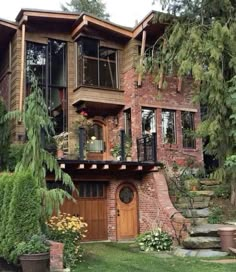 a large brick house with lots of windows