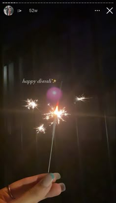 someone holding a sparkler in their hand with the words happy diwal on it