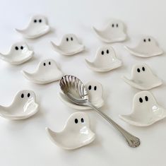 a spoon and some white ghost shaped dishes