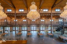 a large room with chandeliers hanging from the ceiling