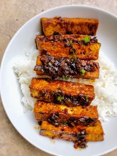 tofu and rice in a white bowl on a table