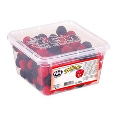 a plastic container filled with red and black raspberries