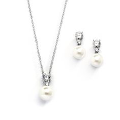 PRICES MAY VARY. LUXURY STYLE: Mariell Classic Style Wedding or Bridesmaid Jewelry Set Features Round-Cut Cubic Zirconai Crystal Accents and Ivory Cream Round Pearl Drops PERFECT SIZE: Elegant Light Ivory 8mm Pearl Earrings with 10mm Pearl Pendant Necklace - Necklace Chain is Adjustable from 16" - 19", Pierced Earring Design with Comfort Disc Backs QUALITY DESIGN: Quality Cubic Zirconia Plated in Genuine Silver Platinum Rhodium - Stunning Necklace and Earring Jewelry Set for Women - Versatile Da Luxury Crystal Necklaces For Anniversary, Wedding Necklace Guide, Bridesmaid Dresses And Jewelry, Earrings And Necklace For Bride, Bridesmaid Accessories Jewelry Pearl, Luxury Adjustable Drop Necklace For Formal Occasions, Pearl Wedding Necklace, Bridal Jewelry Pearl Sets, Pearl Bridesmaid Jewelry