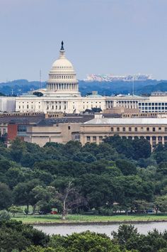 the u s capitol building in washington, d c is seen from across the river